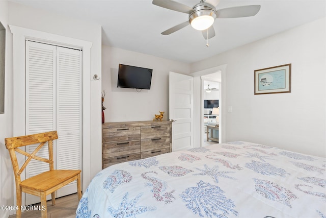 bedroom with ceiling fan and a closet