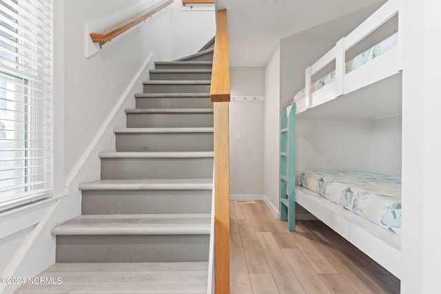 stairway featuring hardwood / wood-style floors