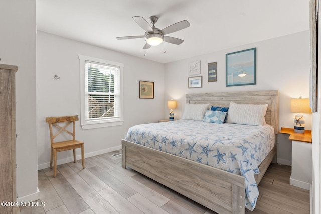 bedroom featuring light hardwood / wood-style flooring and ceiling fan