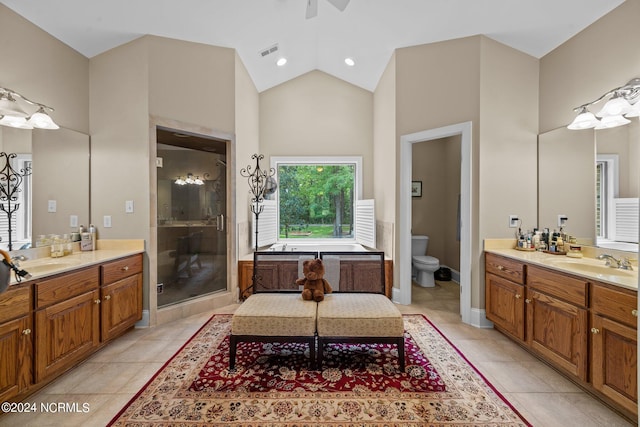 bathroom with vanity, toilet, walk in shower, and tile patterned flooring