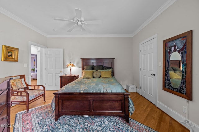 bedroom featuring light hardwood / wood-style flooring, ceiling fan, and ornamental molding