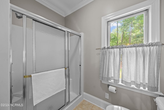 bathroom with crown molding, toilet, walk in shower, and tile patterned flooring