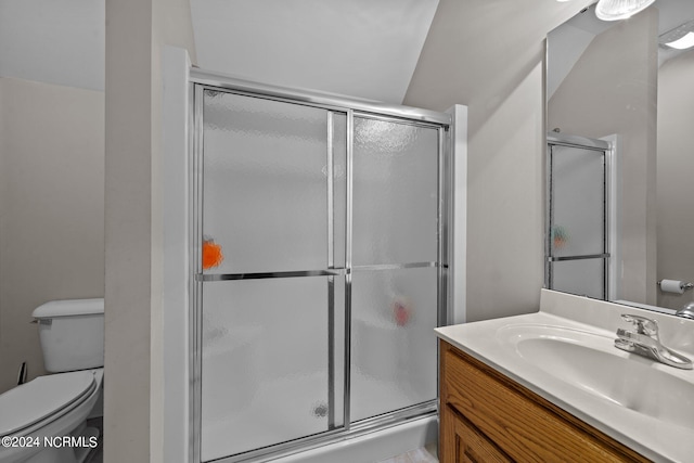 bathroom featuring walk in shower, toilet, vaulted ceiling, and vanity