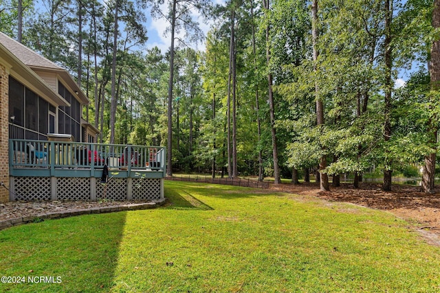 view of yard featuring a wooden deck