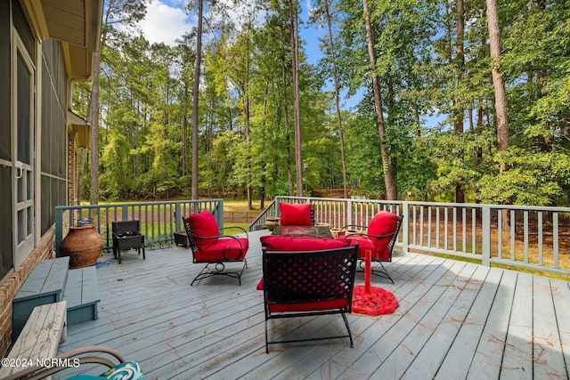 wooden deck featuring an outdoor hangout area