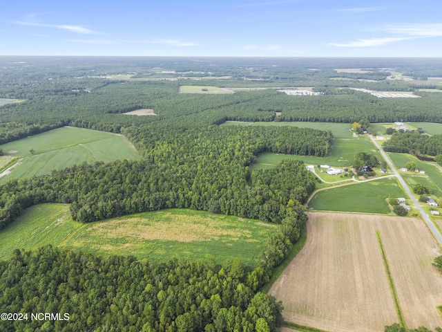 birds eye view of property with a rural view