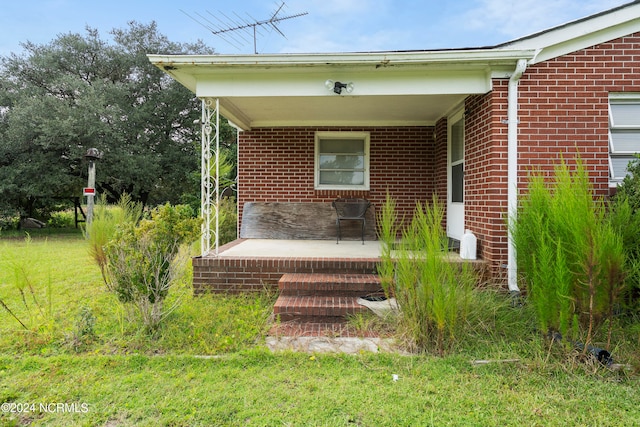 exterior space featuring a yard and covered porch