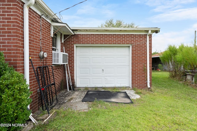 garage featuring a lawn