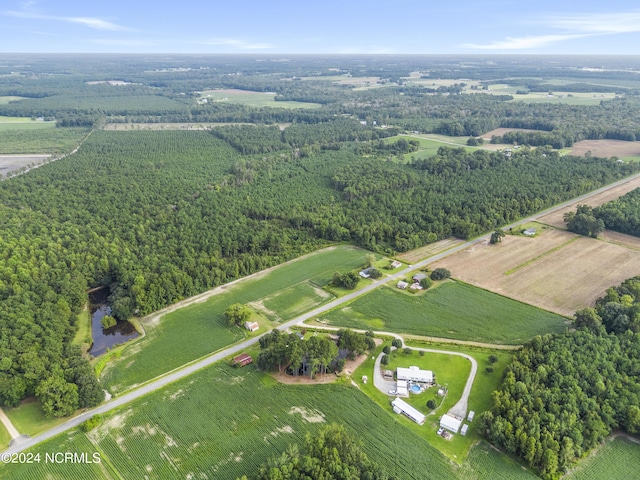 aerial view with a rural view and a wooded view