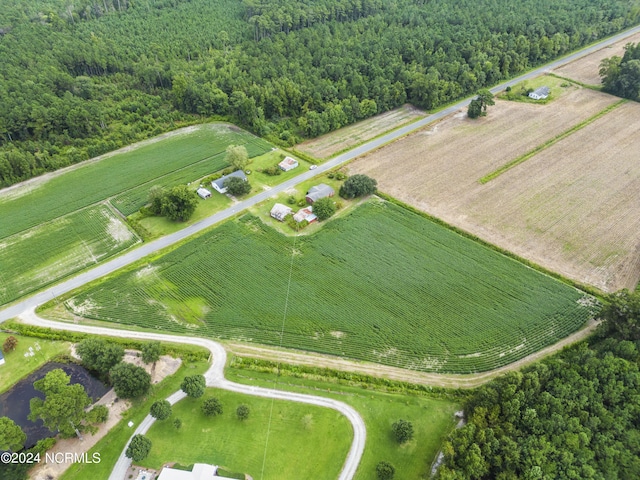 birds eye view of property with a wooded view and a rural view