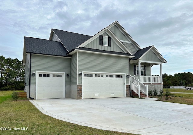 craftsman house with a porch and a garage