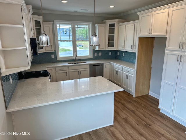 kitchen featuring dishwasher, dark wood-type flooring, sink, decorative light fixtures, and white cabinetry