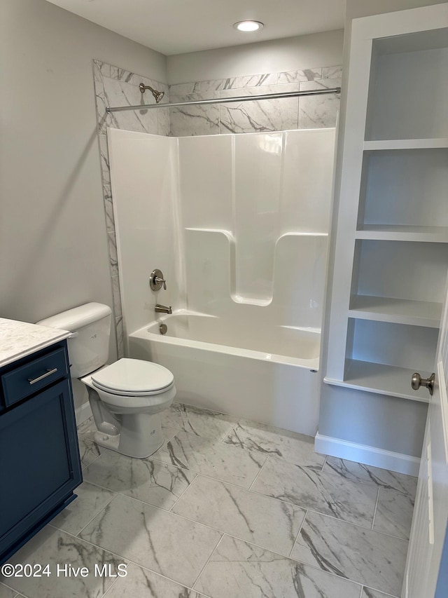 full bathroom featuring tiled shower / bath combo, toilet, and vanity