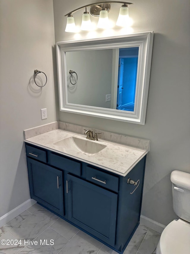 bathroom with vanity and toilet