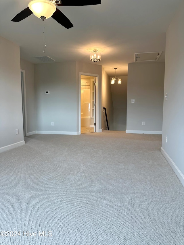 empty room with carpet floors and ceiling fan