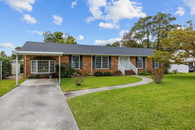 ranch-style home featuring brick siding, roof with shingles, a front yard, and fence