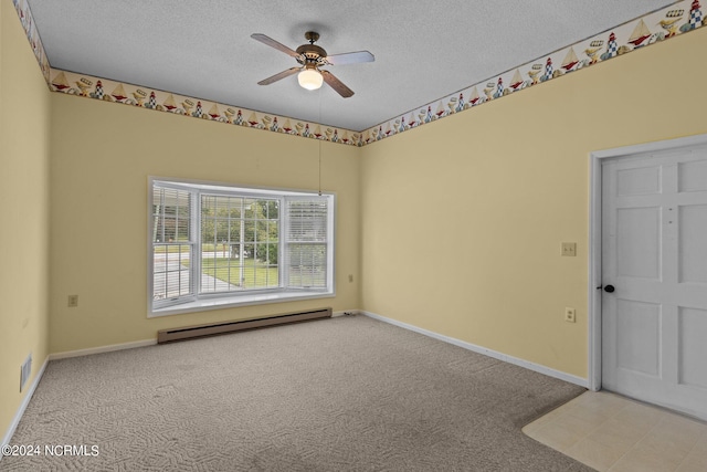 carpeted spare room with a baseboard heating unit, ceiling fan, and a textured ceiling