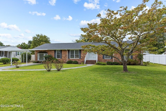 ranch-style home featuring a front yard