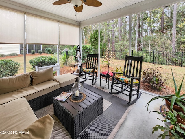 sunroom with wooden ceiling and ceiling fan