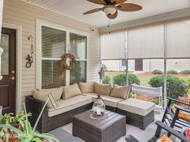 sunroom with wood ceiling and ceiling fan