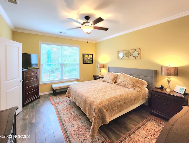 bedroom with ceiling fan, ornamental molding, and dark hardwood / wood-style flooring