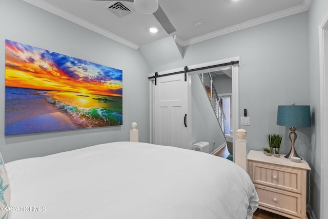 bedroom featuring crown molding, ceiling fan, and a barn door