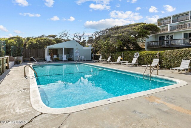 view of swimming pool featuring a patio