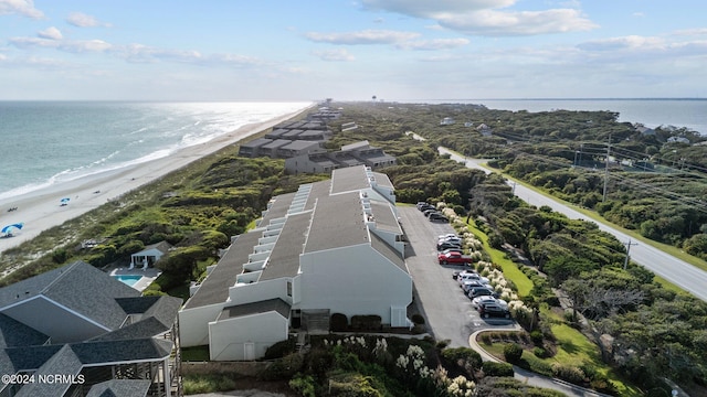 aerial view featuring a view of the beach and a water view