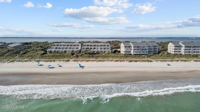 bird's eye view featuring a view of the beach and a water view