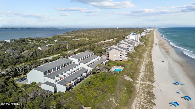 birds eye view of property with a view of the beach and a water view