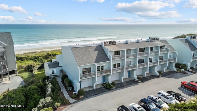 aerial view with a view of the beach and a water view