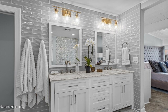 bathroom with vanity and hardwood / wood-style floors