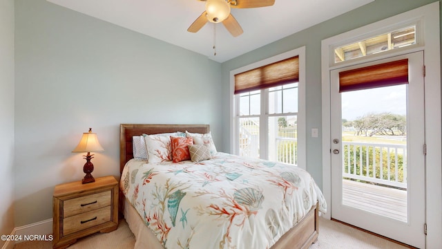 bedroom with baseboards, ceiling fan, access to outside, and light colored carpet