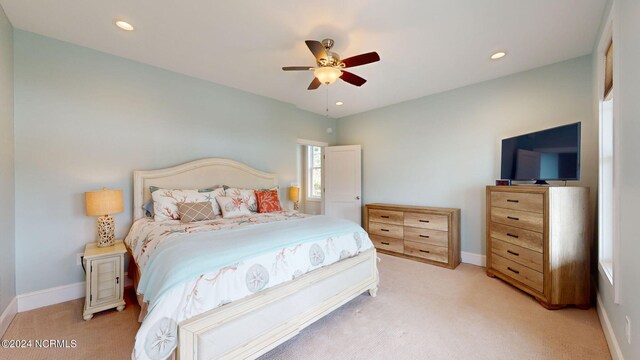 bedroom featuring recessed lighting, ceiling fan, light colored carpet, and baseboards