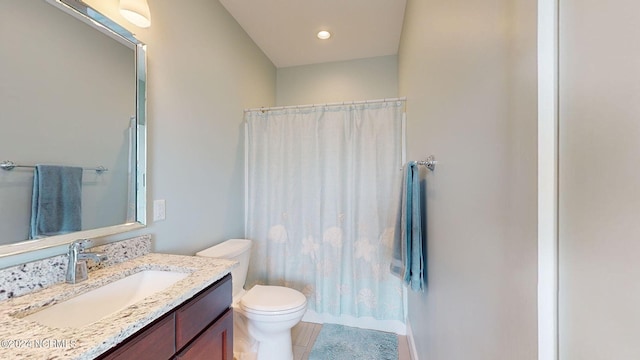 bathroom featuring tile patterned floors, walk in shower, toilet, and vanity