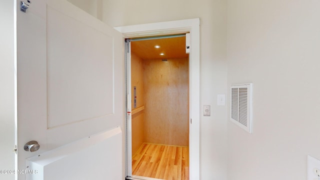 interior space featuring visible vents and elevator