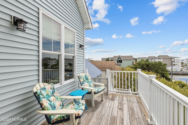 wooden deck with a residential view