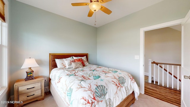 carpeted bedroom with a ceiling fan