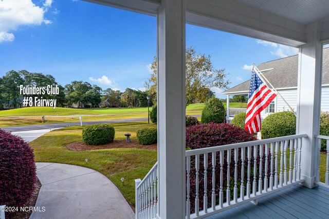 3184 Wild Azalea Way SE, Southport, NC 28461 - covered porch featuring a yard
