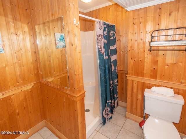 bathroom with walk in shower, tile patterned floors, crown molding, toilet, and wooden walls