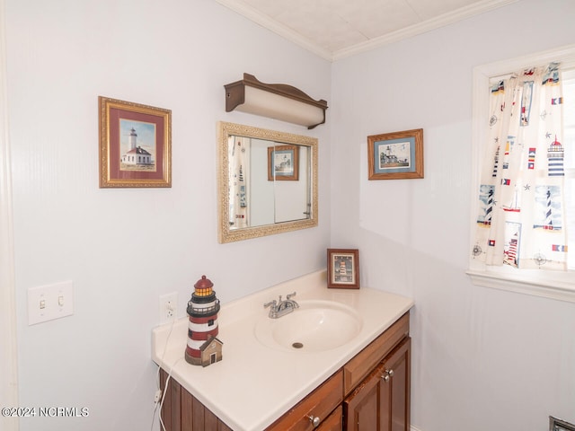 bathroom with vanity and ornamental molding