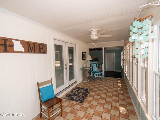 unfurnished sunroom with french doors and ceiling fan