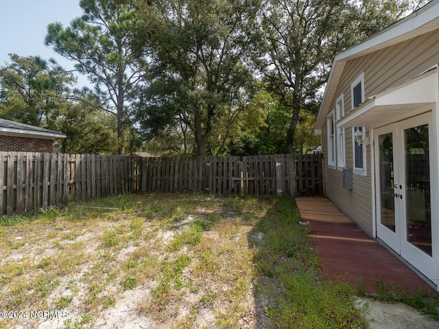 view of yard featuring french doors