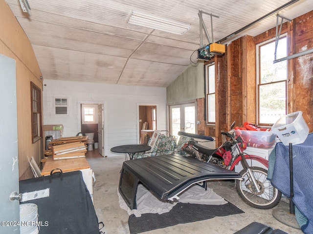 miscellaneous room featuring concrete floors and vaulted ceiling