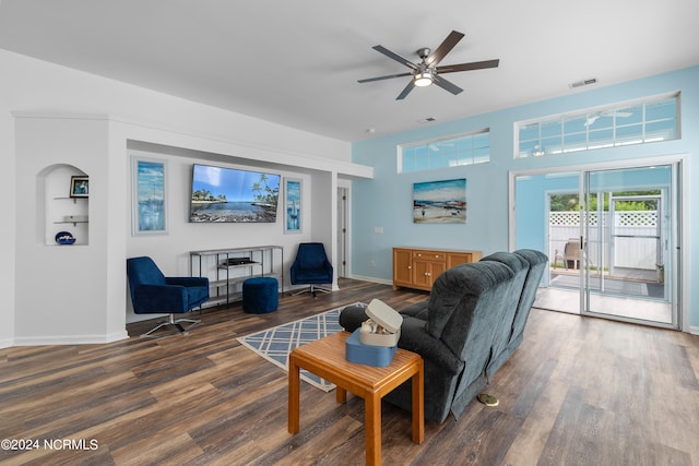 living room with wood-type flooring and ceiling fan