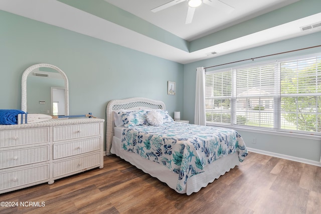 bedroom with ceiling fan and dark hardwood / wood-style floors