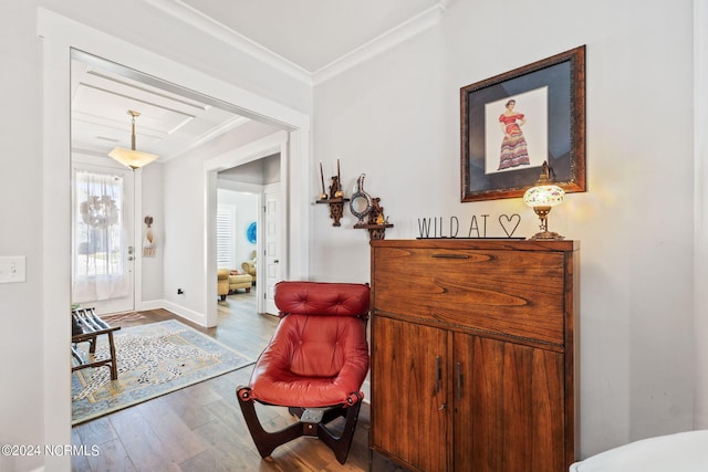 interior space featuring ornamental molding and hardwood / wood-style flooring