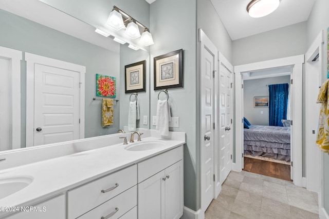 bathroom with tile patterned flooring and vanity