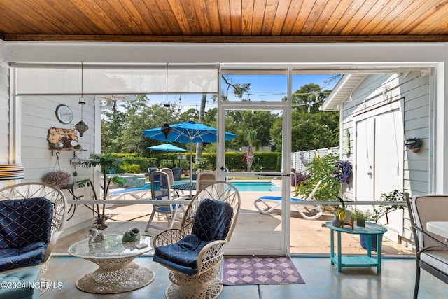 sunroom featuring wood ceiling