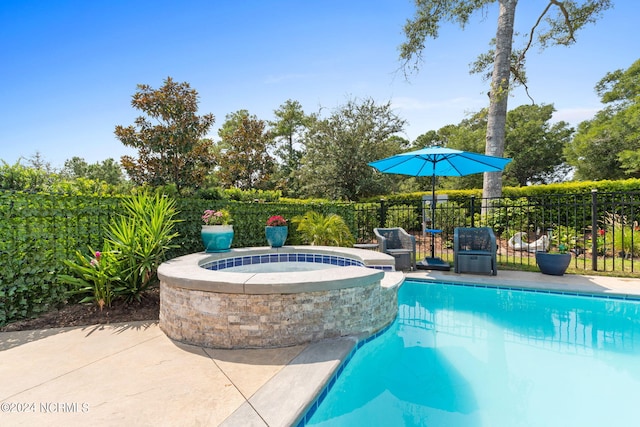 view of swimming pool with a patio area